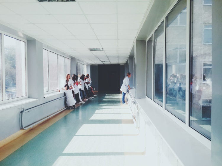 doctors and residents in hospital hallway
