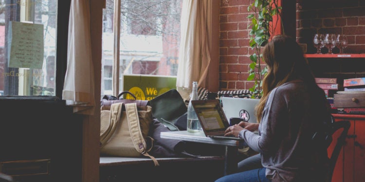 Photo of woman working on laptop